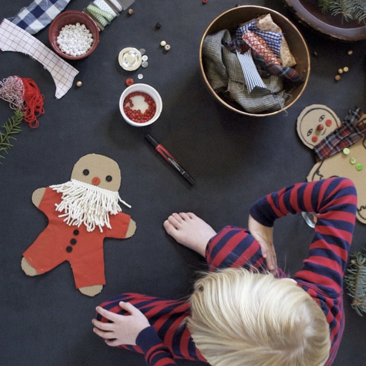 Young child crafting a Christmas ornament