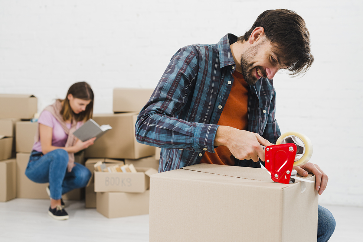 young couple packing their belongings